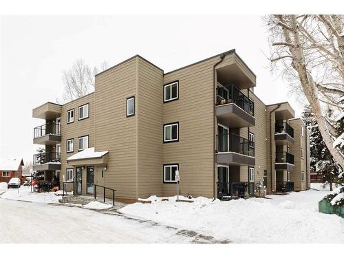 306-36 Glenbrook Crescent, Cochrane, AB - Outdoor With Balcony With Facade