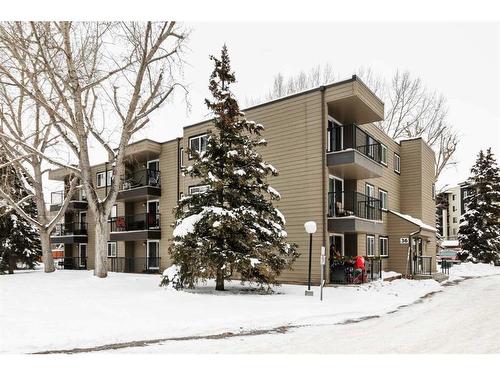 306-36 Glenbrook Crescent, Cochrane, AB - Outdoor With Balcony With Facade