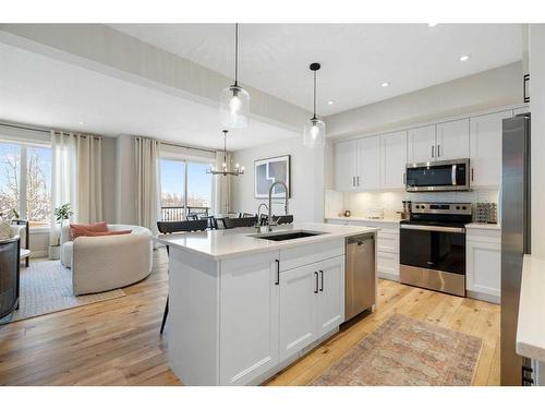 40 Willow Street, Cochrane, AB - Indoor Photo Showing Kitchen With Upgraded Kitchen