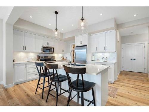 40 Willow Street, Cochrane, AB - Indoor Photo Showing Kitchen With Upgraded Kitchen