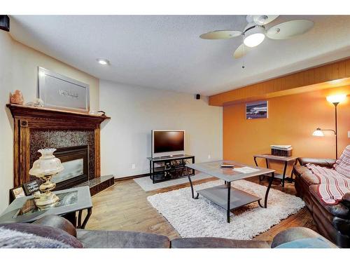 303 1 Street, Irricana, AB - Indoor Photo Showing Living Room With Fireplace