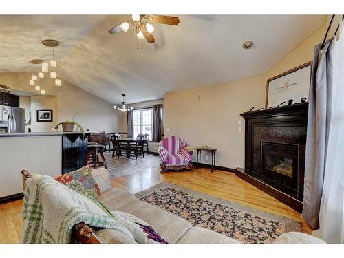 303 1 Street, Irricana, AB - Indoor Photo Showing Living Room With Fireplace