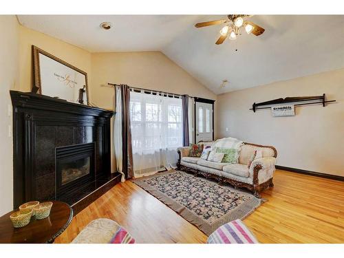 303 1 Street, Irricana, AB - Indoor Photo Showing Living Room With Fireplace