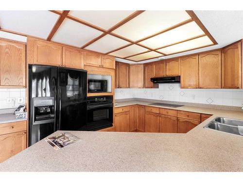 33 Shawnee View Sw, Calgary, AB - Indoor Photo Showing Kitchen With Double Sink