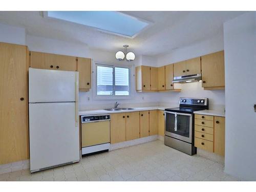 208 Edgedale Way Nw, Calgary, AB - Indoor Photo Showing Kitchen With Double Sink