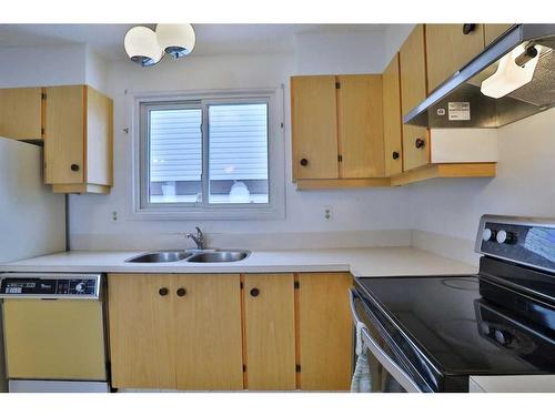 208 Edgedale Way Nw, Calgary, AB - Indoor Photo Showing Kitchen With Double Sink