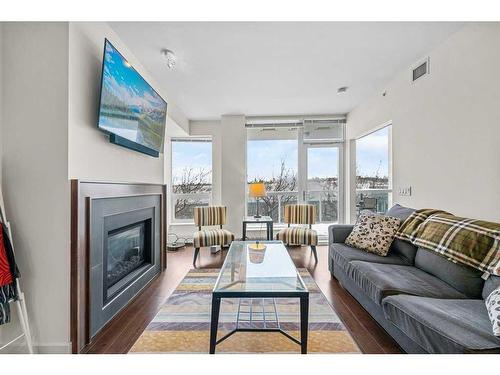 812-222 Riverfront Avenue Sw, Calgary, AB - Indoor Photo Showing Living Room With Fireplace