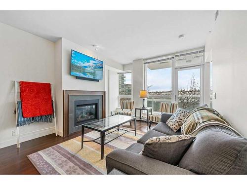 812-222 Riverfront Avenue Sw, Calgary, AB - Indoor Photo Showing Living Room With Fireplace