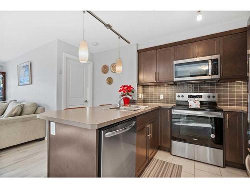 3207-402 Kincora Glen Road Nw, Calgary, AB - Indoor Photo Showing Kitchen With Stainless Steel Kitchen With Double Sink