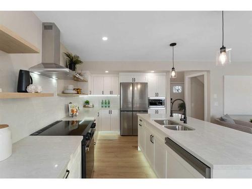 114 Bridleridge Circle Sw, Calgary, AB - Indoor Photo Showing Kitchen With Double Sink With Upgraded Kitchen