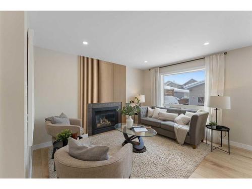 114 Bridleridge Circle Sw, Calgary, AB - Indoor Photo Showing Living Room With Fireplace