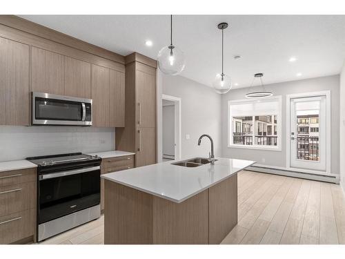 3415-111 Wolf Creek Drive Se, Calgary, AB - Indoor Photo Showing Kitchen With Double Sink With Upgraded Kitchen