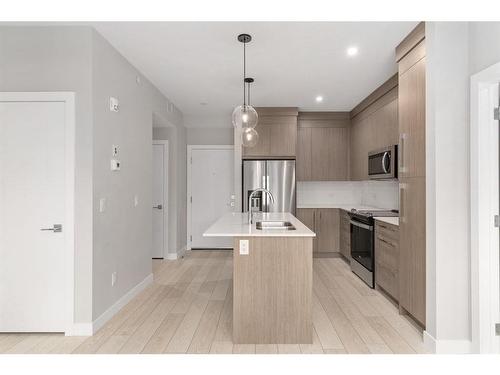 3415-111 Wolf Creek Drive Se, Calgary, AB - Indoor Photo Showing Kitchen With Double Sink With Upgraded Kitchen