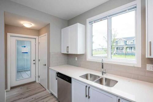 151 Redstone Drive Ne, Calgary, AB - Indoor Photo Showing Kitchen With Double Sink