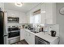 116 Falmere Way Ne, Calgary, AB  - Indoor Photo Showing Kitchen With Stainless Steel Kitchen With Double Sink 