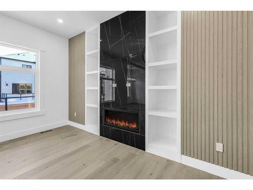 127 Saddlepeace Manor Ne, Calgary, AB - Indoor With Fireplace