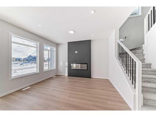 374 Corner Glen Way Ne, Calgary, AB - Indoor Photo Showing Other Room With Fireplace