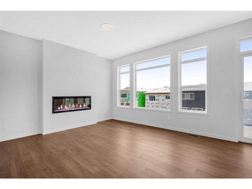 50 Lucas Place Nw, Calgary, AB - Indoor Photo Showing Living Room With Fireplace