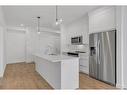 2314-111 Wolf Creek Drive Se, Calgary, AB  - Indoor Photo Showing Kitchen With Upgraded Kitchen 