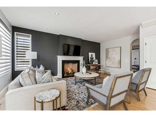 3 Spring Mews Sw, Calgary, AB - Indoor Photo Showing Living Room With Fireplace