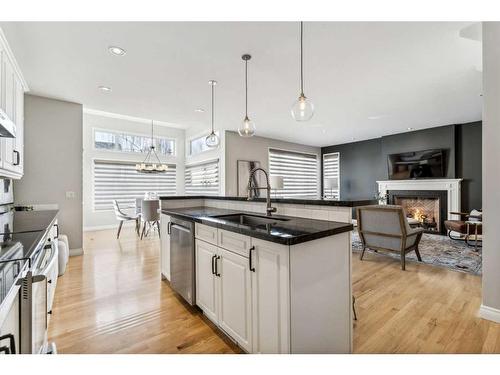 3 Spring Mews Sw, Calgary, AB - Indoor Photo Showing Kitchen With Fireplace With Upgraded Kitchen