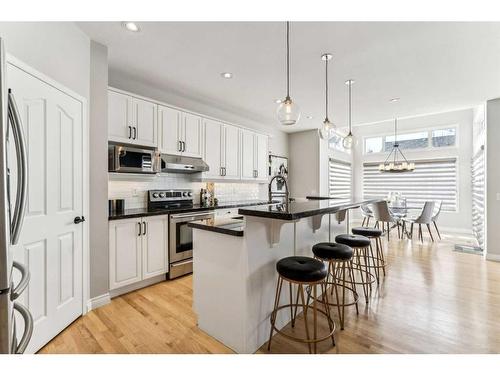 3 Spring Mews Sw, Calgary, AB - Indoor Photo Showing Kitchen With Stainless Steel Kitchen With Upgraded Kitchen