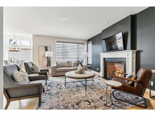 3 Spring Mews Sw, Calgary, AB - Indoor Photo Showing Living Room With Fireplace