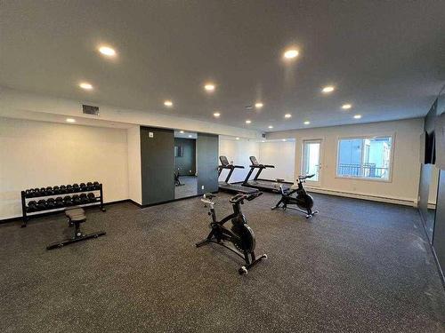 1304-111 Wolf Creek Drive Se, Calgary, AB - Indoor Photo Showing Gym Room