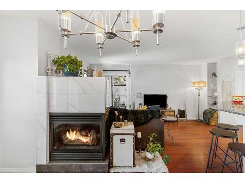 2-1909 25A Street Sw, Calgary, AB - Indoor With Fireplace