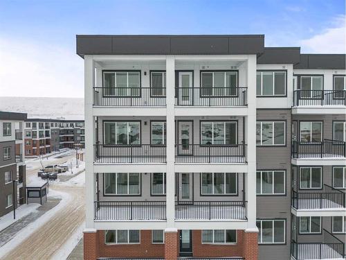 1305-111 Wolf Creek Drive Se, Calgary, AB - Outdoor With Facade