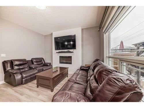 43 Baysprings Way Sw, Airdrie, AB - Indoor Photo Showing Living Room With Fireplace