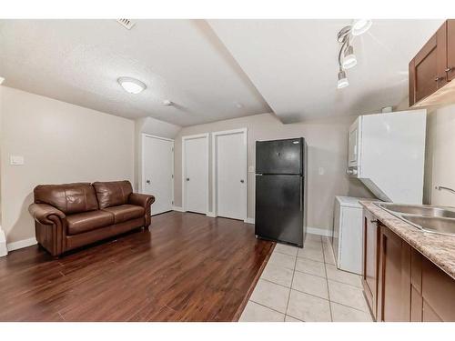 43 Baysprings Way Sw, Airdrie, AB - Indoor Photo Showing Kitchen With Double Sink