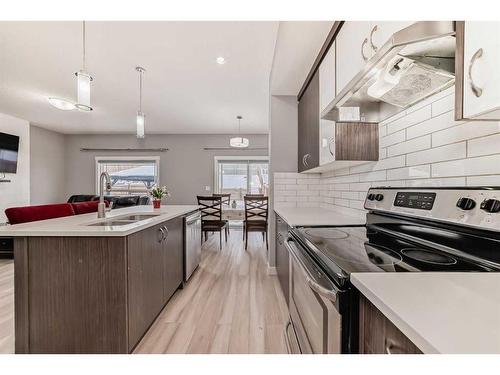 43 Baysprings Way Sw, Airdrie, AB - Indoor Photo Showing Kitchen With Upgraded Kitchen