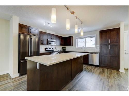 135 Baysprings Terrace, Airdrie, AB - Indoor Photo Showing Kitchen With Stainless Steel Kitchen With Upgraded Kitchen