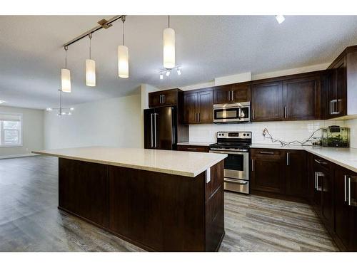 135 Baysprings Terrace, Airdrie, AB - Indoor Photo Showing Kitchen With Stainless Steel Kitchen With Upgraded Kitchen