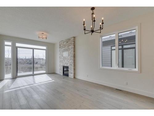 71 Royal Birch Cove Nw, Calgary, AB - Indoor With Fireplace