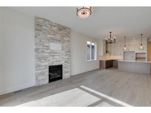 71 Royal Birch Cove Nw, Calgary, AB - Indoor Photo Showing Living Room With Fireplace