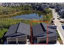 71 Royal Birch Cove Nw, Calgary, AB  - Outdoor With Body Of Water With View 