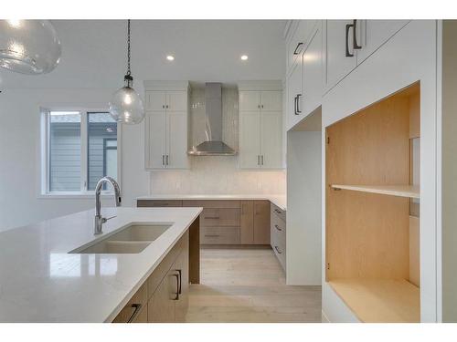 71 Royal Birch Cove Nw, Calgary, AB - Indoor Photo Showing Kitchen With Double Sink