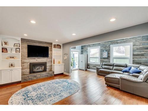 151 Midvalley Place Se, Calgary, AB - Indoor Photo Showing Living Room With Fireplace