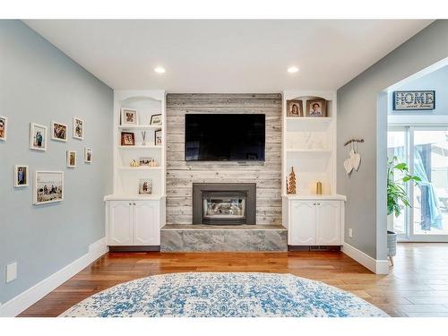 151 Midvalley Place Se, Calgary, AB - Indoor Photo Showing Living Room With Fireplace