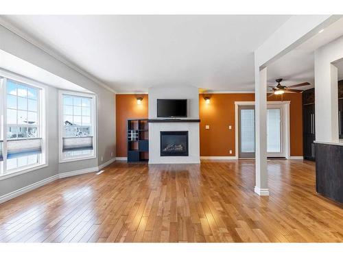 332 Butte Place, Stavely, AB - Indoor Photo Showing Living Room With Fireplace