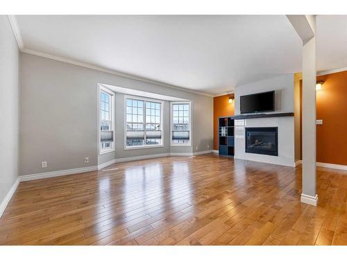 332 Butte Place, Stavely, AB - Indoor Photo Showing Living Room With Fireplace