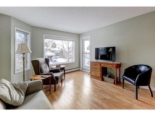 206-1206 Hawksbrow Point Nw, Calgary, AB - Indoor Photo Showing Living Room