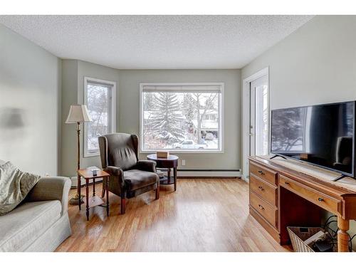 206-1206 Hawksbrow Point Nw, Calgary, AB - Indoor Photo Showing Living Room