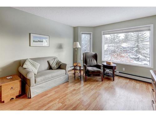 206-1206 Hawksbrow Point Nw, Calgary, AB - Indoor Photo Showing Living Room