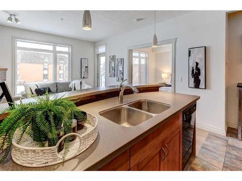 205-2 Hemlock Crescent Sw, Calgary, AB - Indoor Photo Showing Kitchen With Double Sink