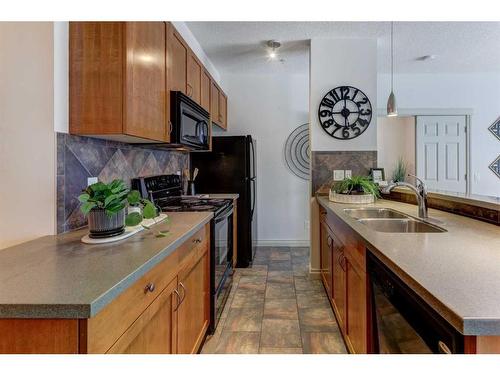 205-2 Hemlock Crescent Sw, Calgary, AB - Indoor Photo Showing Kitchen With Double Sink