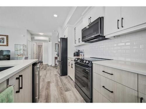 416-80 Carrington Plaza Nw, Calgary, AB - Indoor Photo Showing Kitchen With Upgraded Kitchen