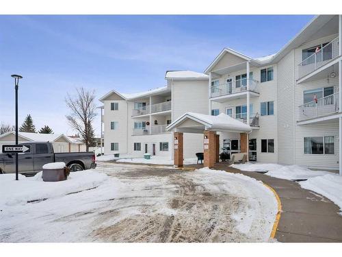 201-3 Parklane Way, Strathmore, AB - Outdoor With Balcony With Facade